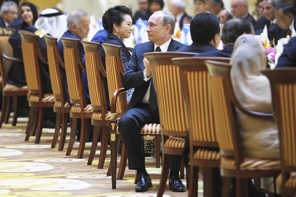 Russian President Vladimir Putin attends a gala dinner ahead of the security summit. Photo: Reuters