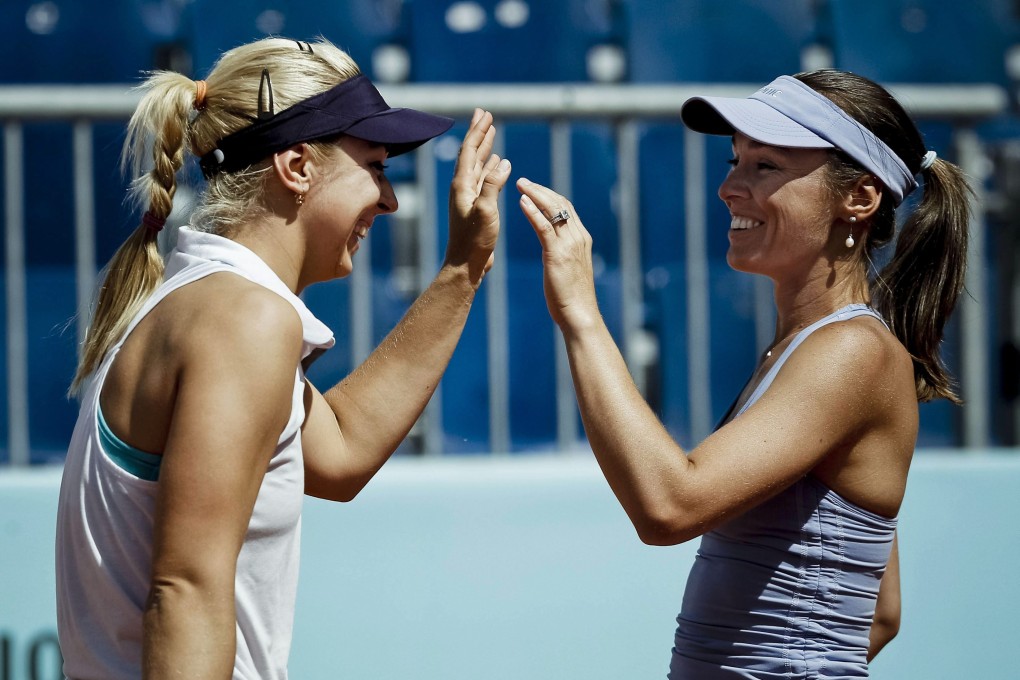 Martina Hingis and Sabine Lisicki in action during a doubles match in the Madrid Open earlier this month. Hingis coaches Lisicki, who is ranked No 17 in the world. Photo: EPA