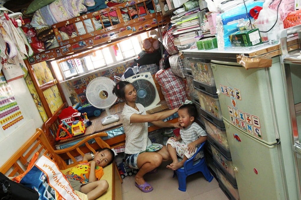 Families like this one living in subdivided flats have a higher risk of contracting and infecting others with airborne diseases. Photo: David Wong