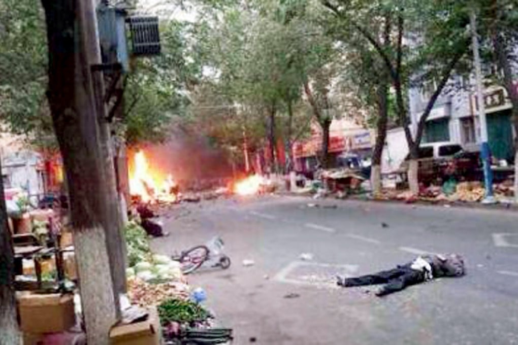 A person lies on the ground after a blast in Urumqi, in an unverified photo. Photo: Weibo