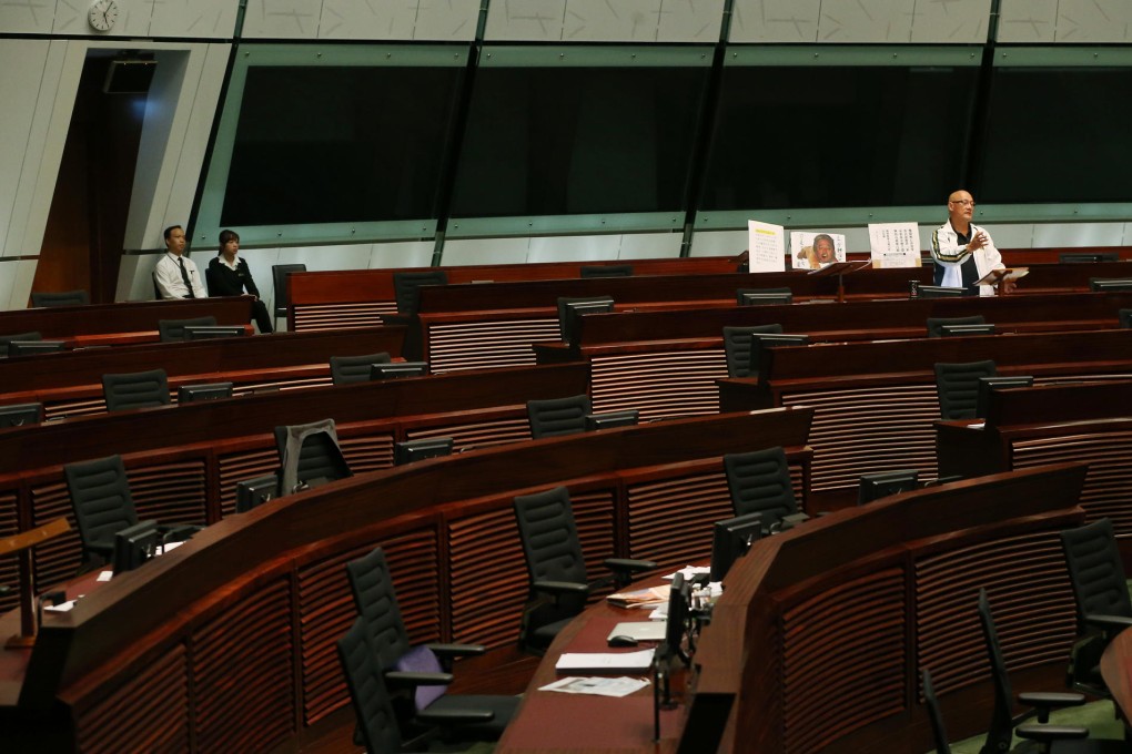 People Power lawmaker Albert Chan Wai-yip gives a speech to an empty Legislative Council chamber.