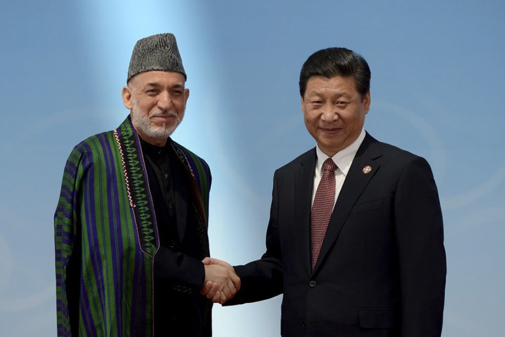 Afghanistan's President Hamid Karzai (left) and Chinese President Xi Jinping shake hands before the opening ceremony of the fourth Conference on Interaction and Confidence Building Measures in Asia (CICA) summit in Shanghai. Photo: Reuters