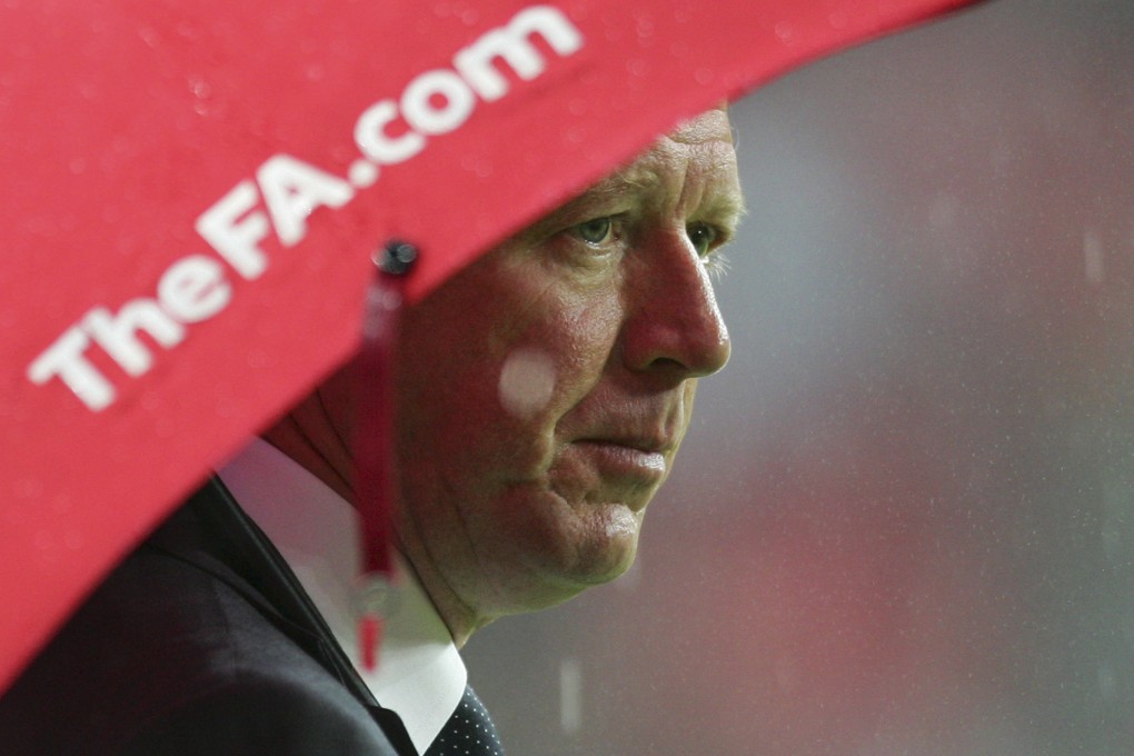 McClaren was lampooned as "the wally with the brolly" after he huddled under an umbrella during a 3-2 defeat against Croatia that shattered England's country's hopes of qualifying for Euro 2008.  Photo: AP