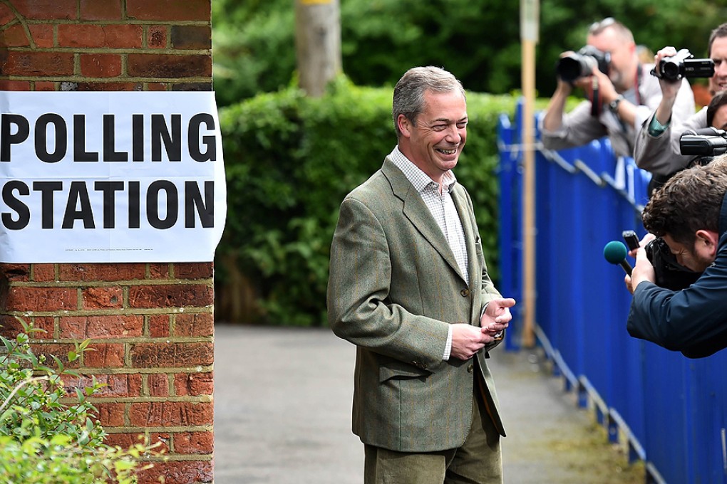 UKIP leader Nigel Farage poses for photographers near Biggin Hill, south of London, before voting in the local and European elections on Thursday. Photo: AFP