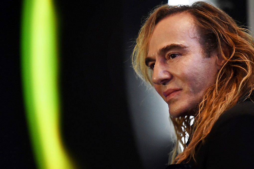 British designer John Galliano gives a press conference on his new work as a consultant for Russian cosmetics retailer L'Etoile. Photo: AFP