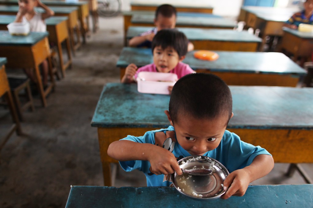 Rules demanding parents prove they live and work locally have sparked claims the authorities are discriminating against low-income residents. Photo: EPA