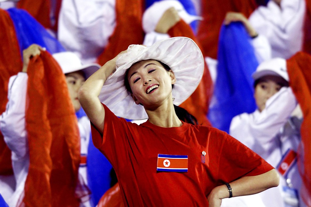A cheerleader from North Korea at the 2002 Asian Games in South Korea. Photo: Antony Dickson