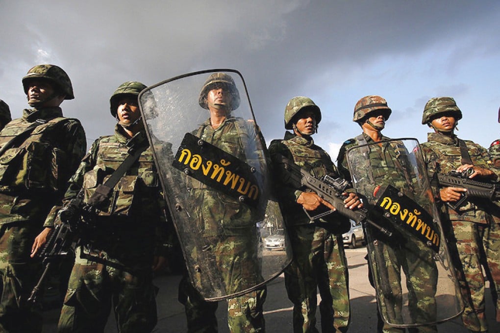 Thai soldiers guard the Army Club in Bangkok after the coup. Photo: Reuters