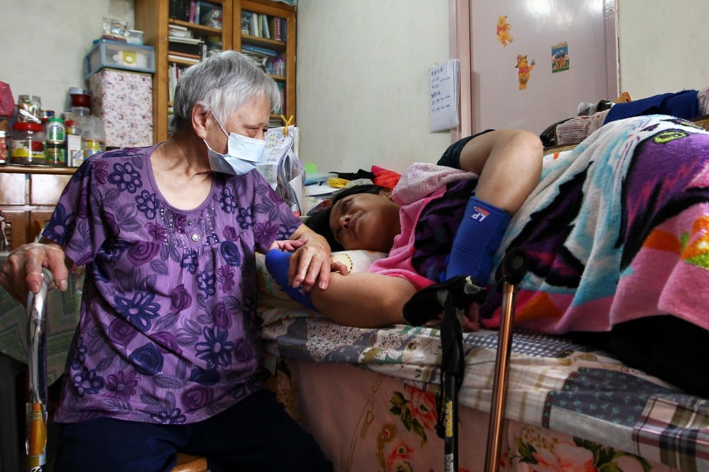 Tina Lau (right) requires daily care. Photo: Jonathan Wong
