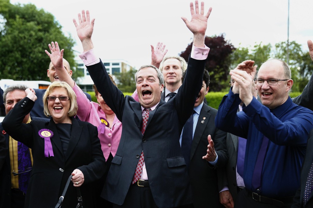 The leader of Britain's UKIP party, Nigel Farage, celebrates with newly elected councillors in Basildon. Photo: Reuters