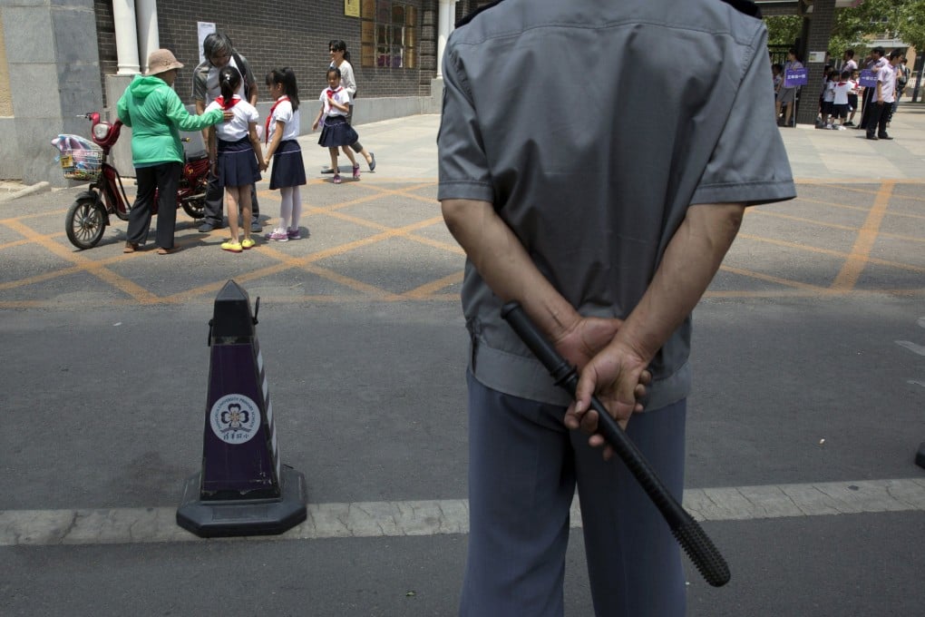 Paramilitary policemen with shields and batons patrol near the People's Square in Urumqi, Xinjiang. 39 people were killed from the bombing at a vegetable market in Urumqi. Photo: AP