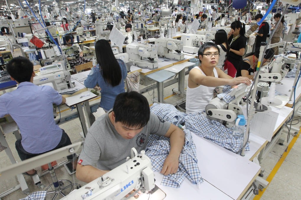 Workers on a shirt production line at TAL's factory in Dongguan. Photo: Edward Wong