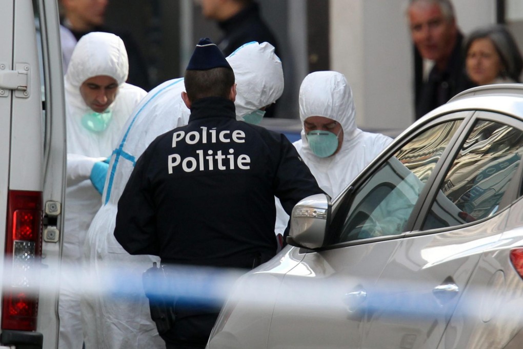 Police officers and crime scene investigators work at the site of the deadly shooting at the Jewish Museum in Brussels. Photo: EPA