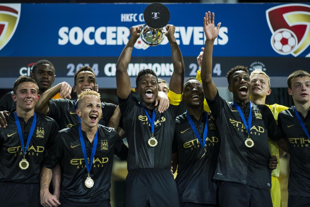 Manchester City players celebrate winning the HKFC Citibank Soccer Sevens after beating Kitchee in the final. Photos: SCMP Pictures