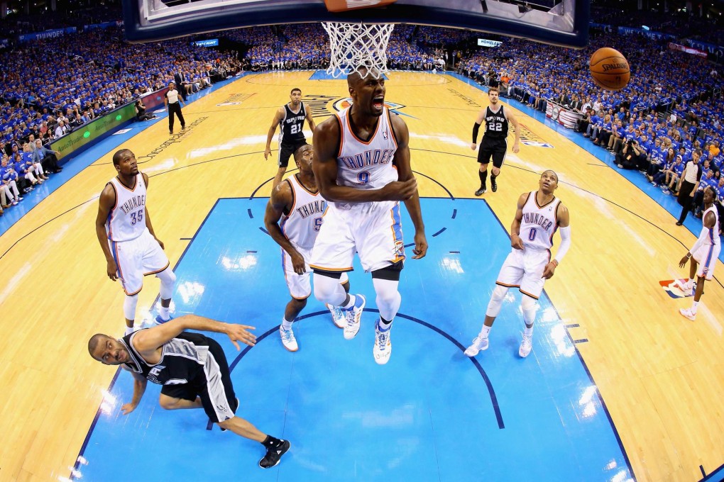 Thunder's Serge Ibaka reacts after blocking the shot of San Antonio's Tony Parker in game three at Chesapeake Energy Arena. Photo: AFP