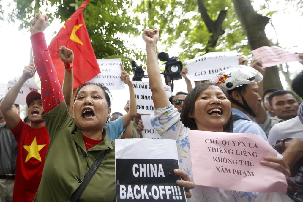 As Vietnamese protest against China's actions in disputed waters, today's workers may become tomorrow's jobless.Photo: EPA