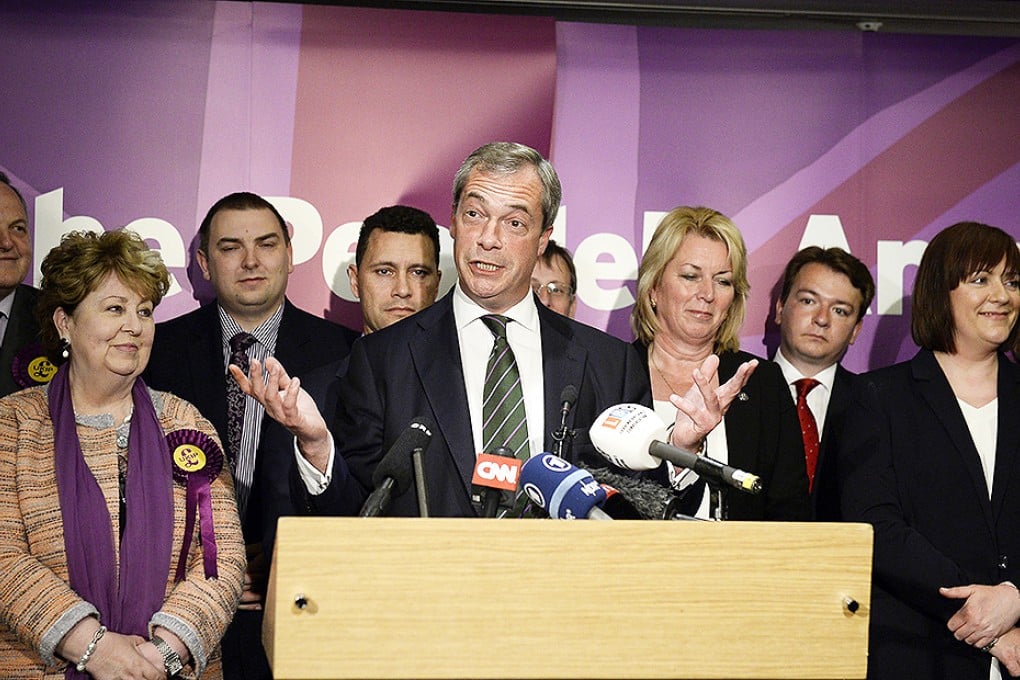 UKIP leader Nigel Farage stands with his newly elected MEPs in London. Photo: EPA