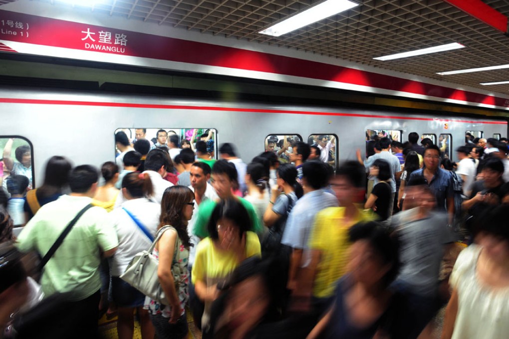 Busy platform during the rush hour in a Beijing underground station.