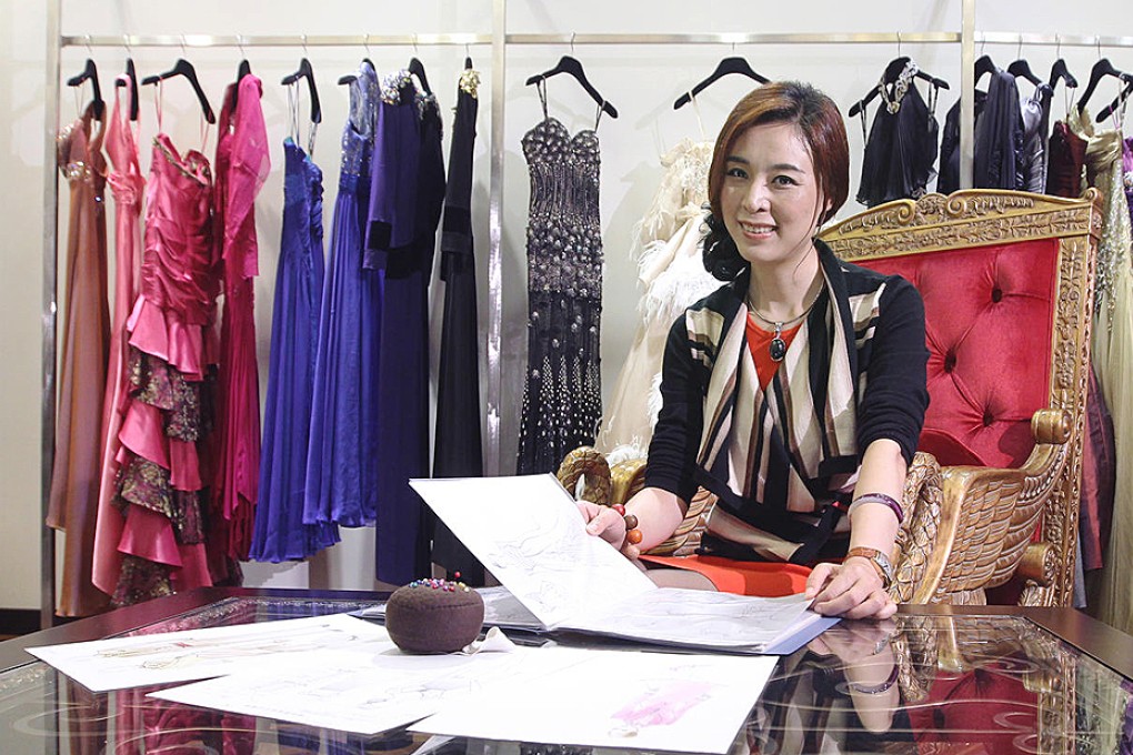 Mu Yan, founder and chief designer of custom tailor M.Y. Bespoke, sits amid creations at her Shenzhen showroom. Photo: Edward Wong