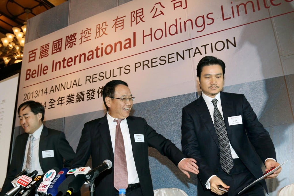 Belle chief Sheng Baijiao (centre) with executives K.K. Leung (left) and Clement Tang. Photo: SCMP