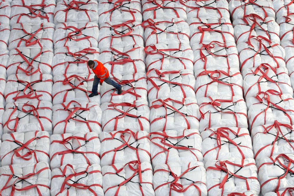 Bags of US rice on a cargo ship for export to Japan, which has raised the ire of farm groups by refusing to cut tariffs. Photo: Bloomberg