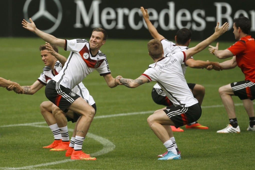 Marco Reus (right) and Kevin Grosskreutz warm up during a Germany training session in the Tyrol. Photo: Reuters