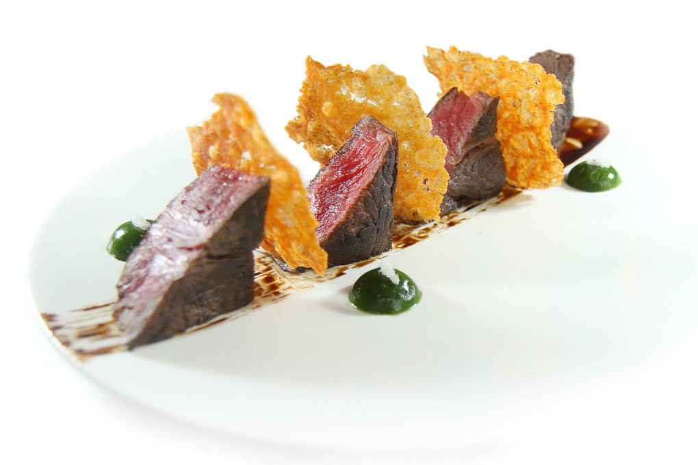 Black Angus cubes, rocket jelly and parmesan chips with vintage balsamic and Hoarfrost salt (above) and Persian Blue salt grated on prawn risotto, malossol caviar and Maltese scampi crudo (below).