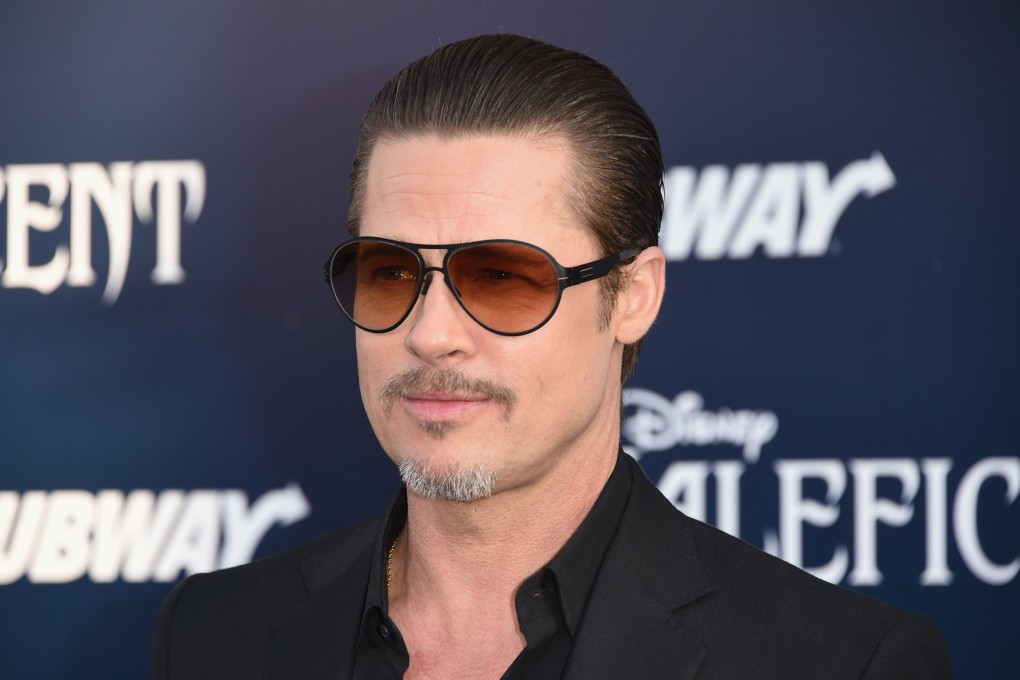 Brad Pitt was reportedly unharmed and continued to sign autographs ahead of the 'Maleficent' screening. Photo: AFP