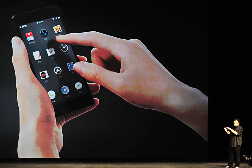 Luo Yonghao, founder of Smartisan Company, introduces the Smartisan T1 at the product launch event in Beijing. Photo: Xinhua