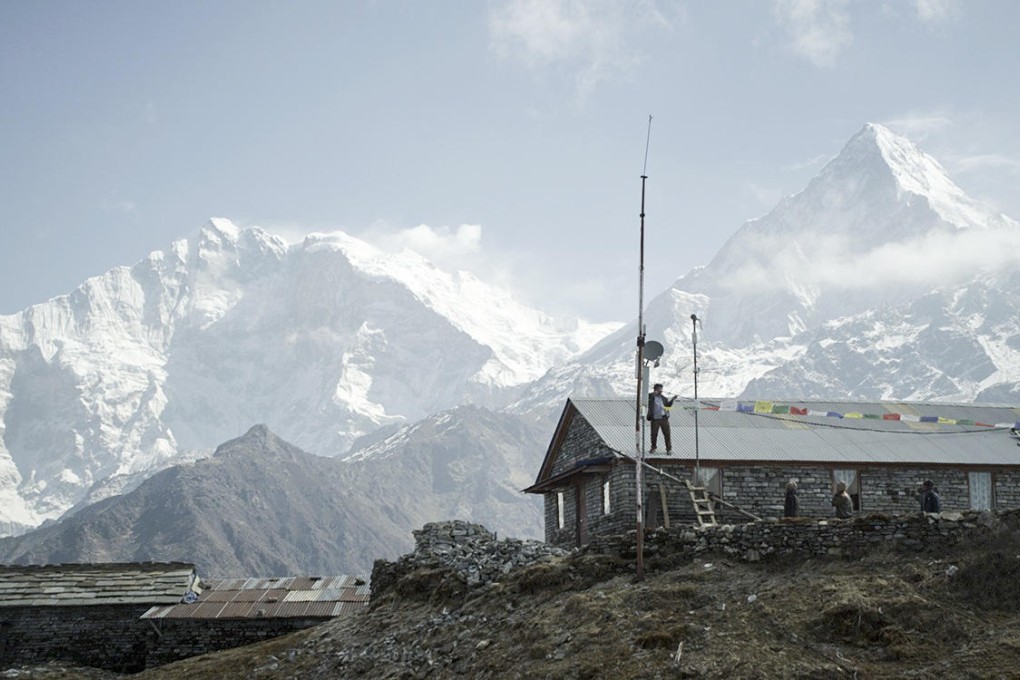 Nepalese web pioneer Mahabir Pun provides internet connection to a rural dwelling. Photos: AFP