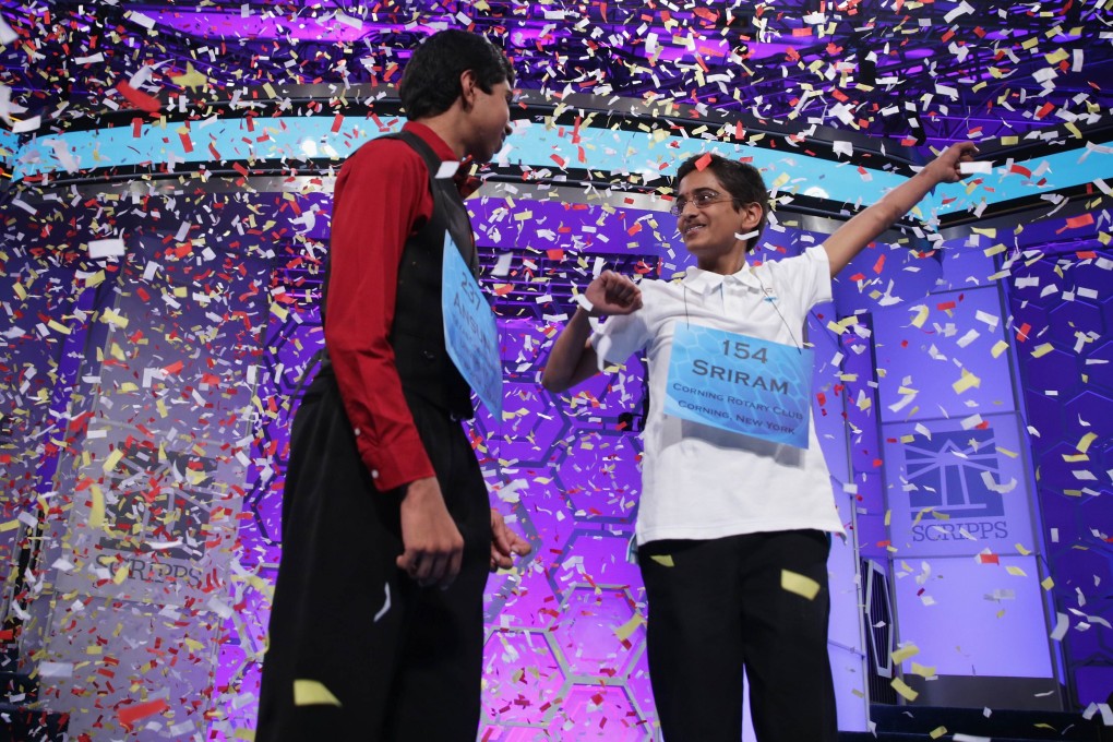Confetti falls after Ansun Sujoe (left) and Sriram Hathwar are announced joint winners of Scripps 2014. Photo: AFP