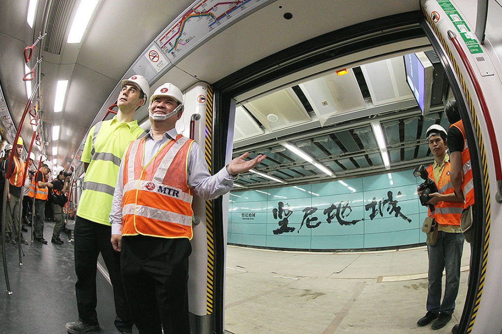 The MTR's Mark Cuzner and Francis Li at Kennedy Town MTR station. Photo: Edward Wong