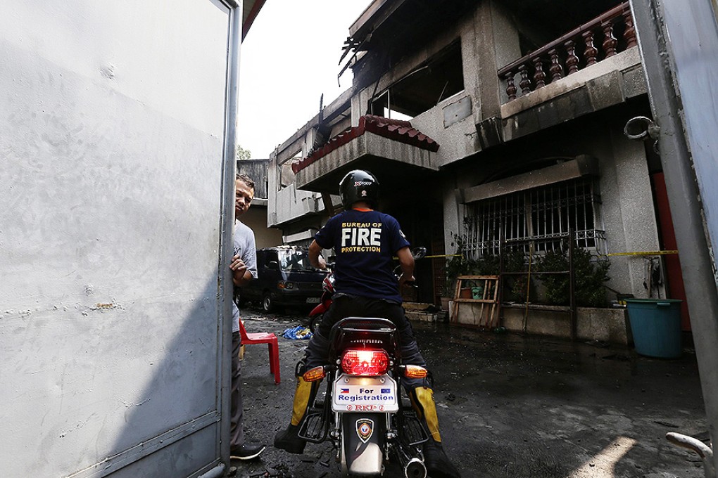 Eight trapped workers died in a padlocked room in a warehouse razed by a fire in Pasay City, south of Manila. Photo: EPA