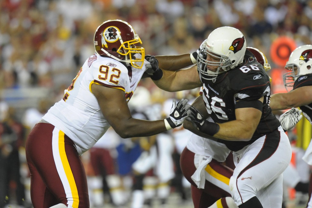 Former Cardinals guard Alan Faneca (right), seen getting to grips with the Redskins' Albert Haynesworth, has lost 100 of the 315 pounds he carried in his playing days. Photo: Reuters
