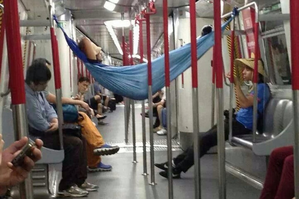 A passenger takes a nap on the MTR. Photo: SMP