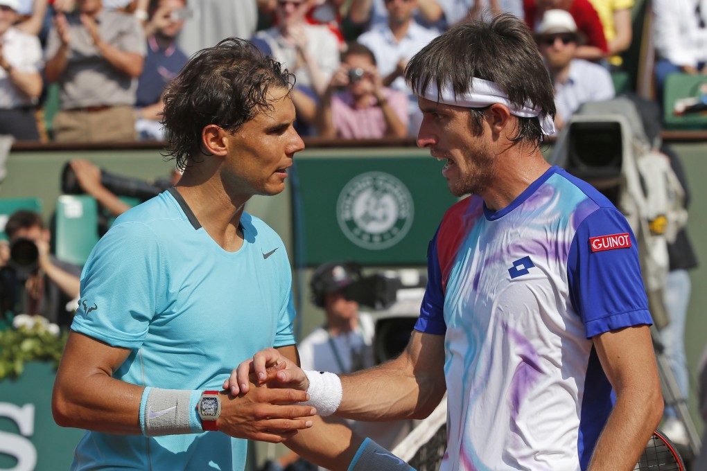 Argentina's Leonardo Mayer, right, congratulates Rafael Nadal after the Spaniard's victory in three sets. Photo: AP