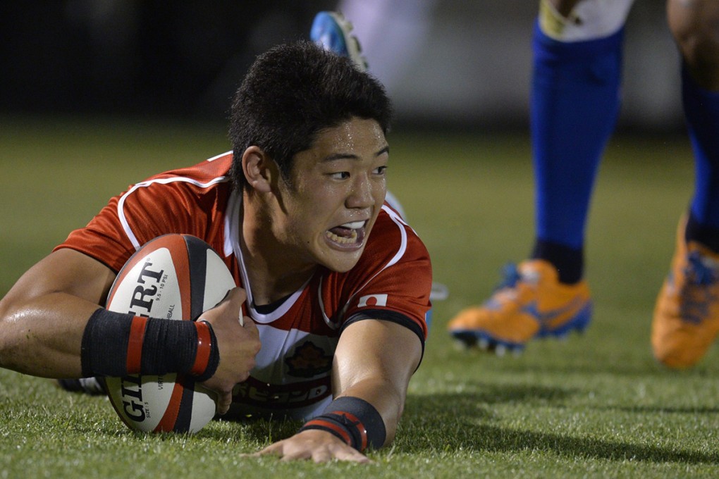 Winger Yoshikazu Fujita scores the first of his two tries during Japan’s surprise 33-14 test victory over Samoa on Friday. Photo: EPA