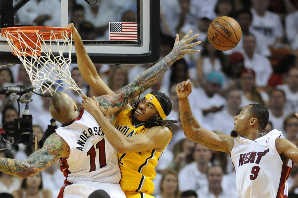 Indiana Pacers forward Chris Copeland is guarded by Miami Heat's Chris Anderson and Rashard Lewis. Photo: EPA
