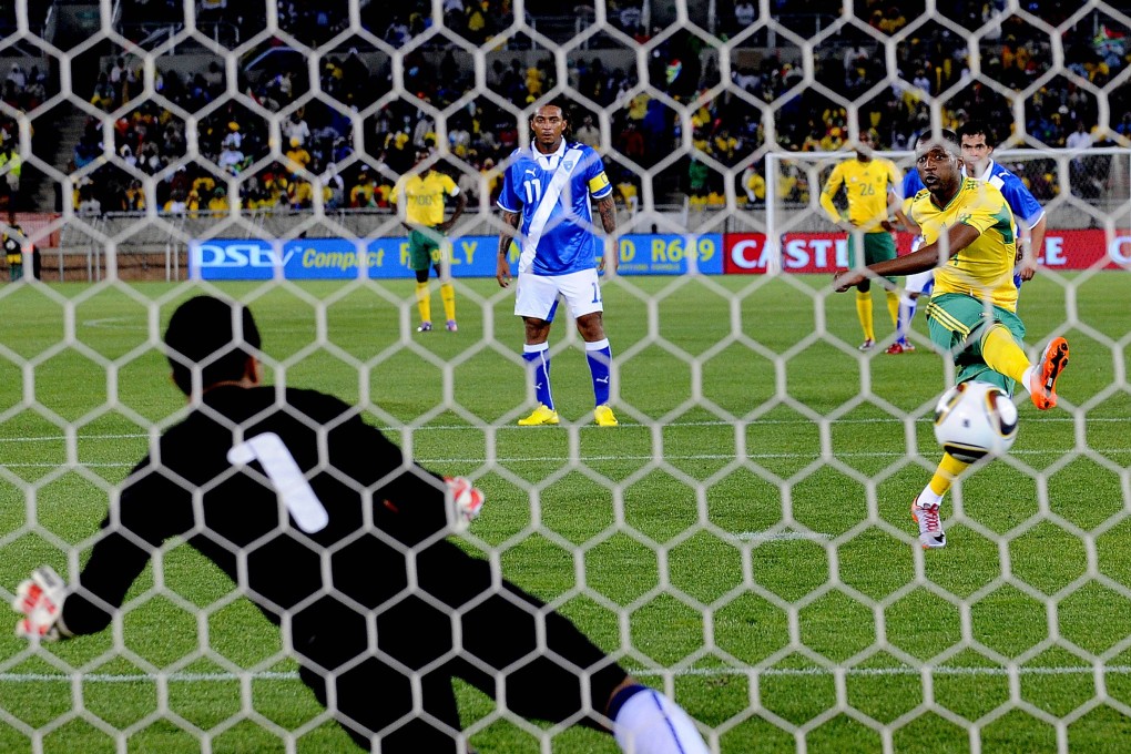 South African striker Katlego Mphela (right) scores on a penalty kick   against Guatemala in 2010 during a friendly match at the Peter Mokaba stadium in Polokwane, South Africa. Photo: AFP