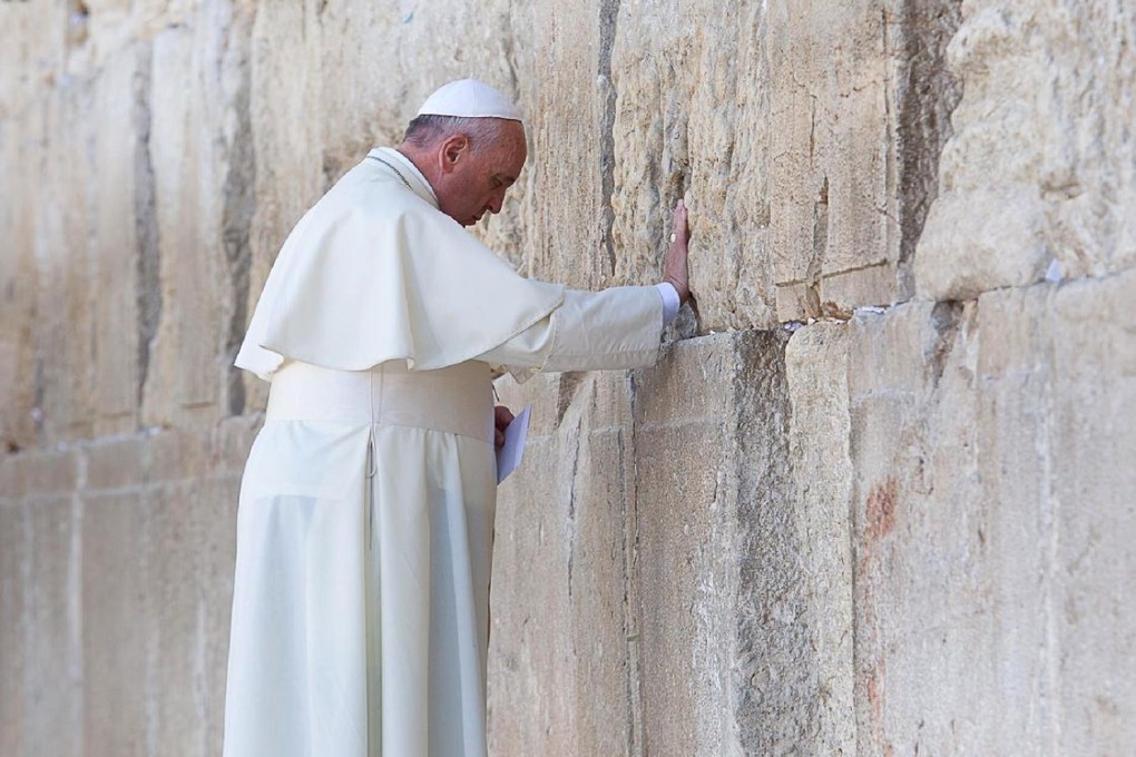 Pope Francis prays at the Western Wall in Jerusalem. Photo: AFP