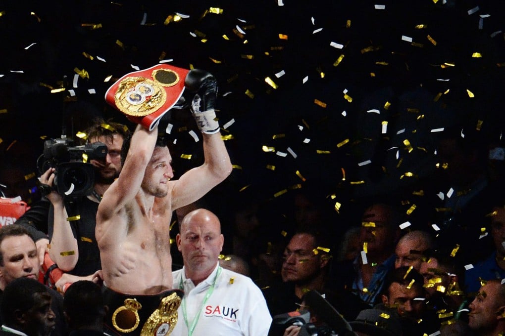 Carl Froch celebrates with the title belt. Photo: EPA