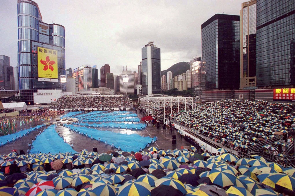 Thousands brave the rain to watch Britain's farewell ceremony on June 30, 1997, hours before the handover of Hong Kong back to China. Photo: Reuters
