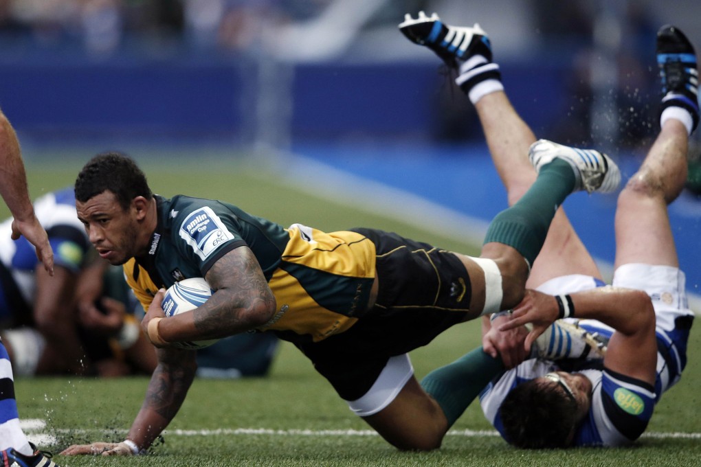 Northhampton lock Courtney Lawes is tackled by Bath hooker Tom Dunn during last week’s European Challenge Cup final. On Saturday, Saints became English champions for the first time when they beat Saracens 24-20 at Twickenham. Photo: AFP