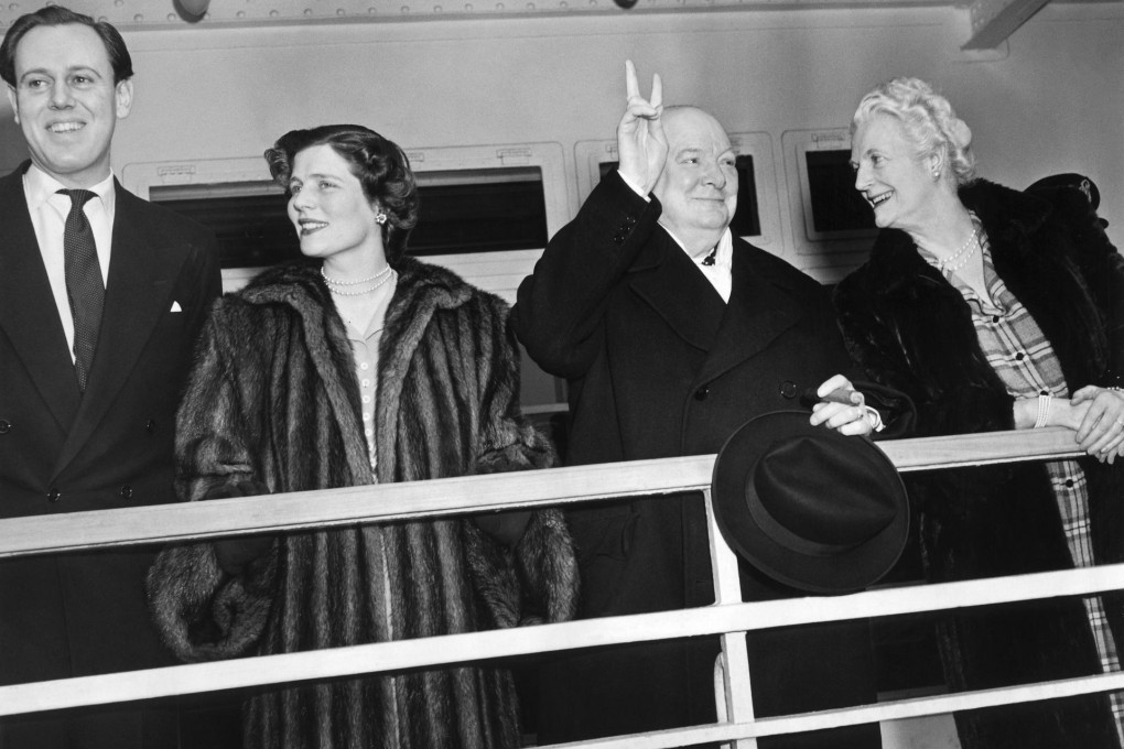 Winston Churchill gives his "V for Victory" sign with daughter Mary and her husband, Captain Christopher Soames, in 1949. Photo: AFP