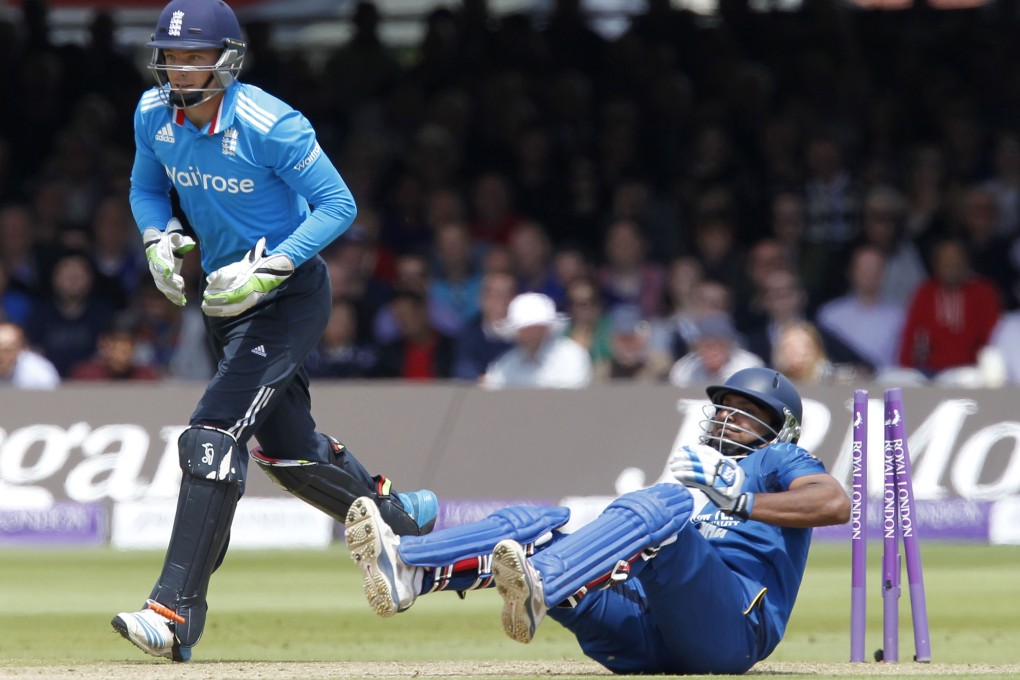 England wicketkeeper Jos Buttler (left) stumps out Sri Lanka's Kumar Sangakkara for 112 runs at Lord's cricket ground. Photo: AFP
