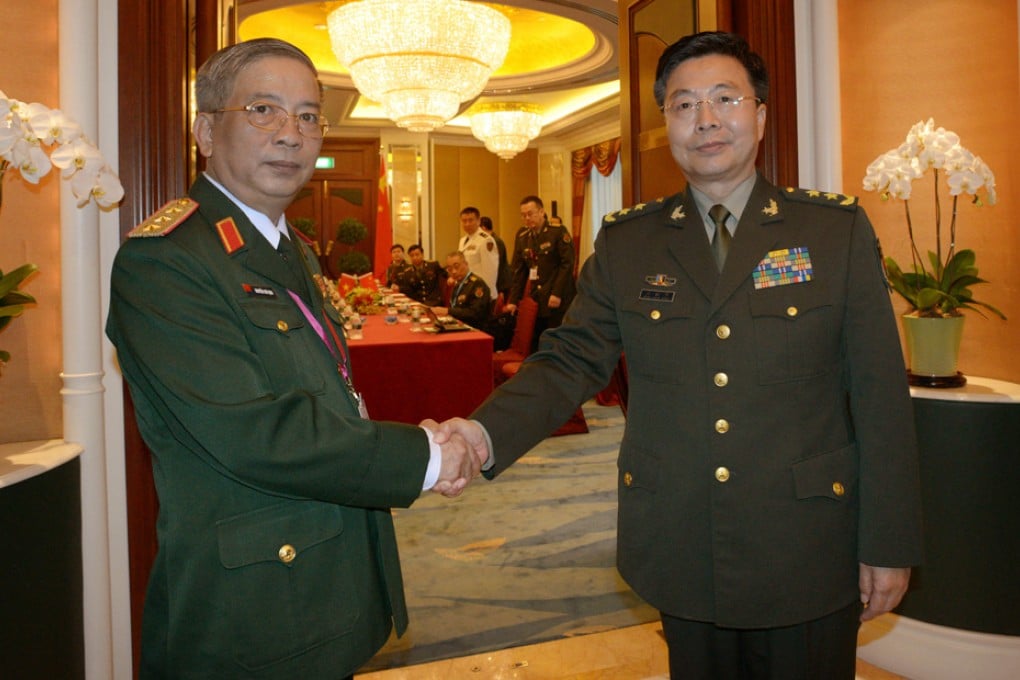 Nguyen Chi Vinh (left) meets Wang Guanzhong. Photo: Xinhua