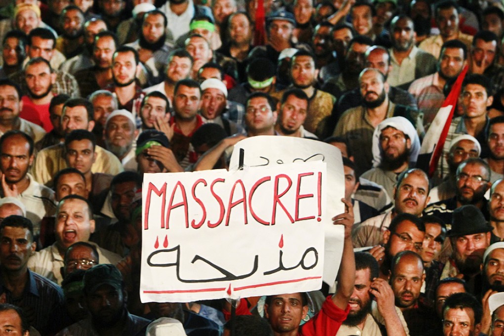 Supporters of deposed Egyptian President Mohammed Mursi take part in a protest in Cairo against the security forces attacked supporters of Mursi. Photo: Reuters