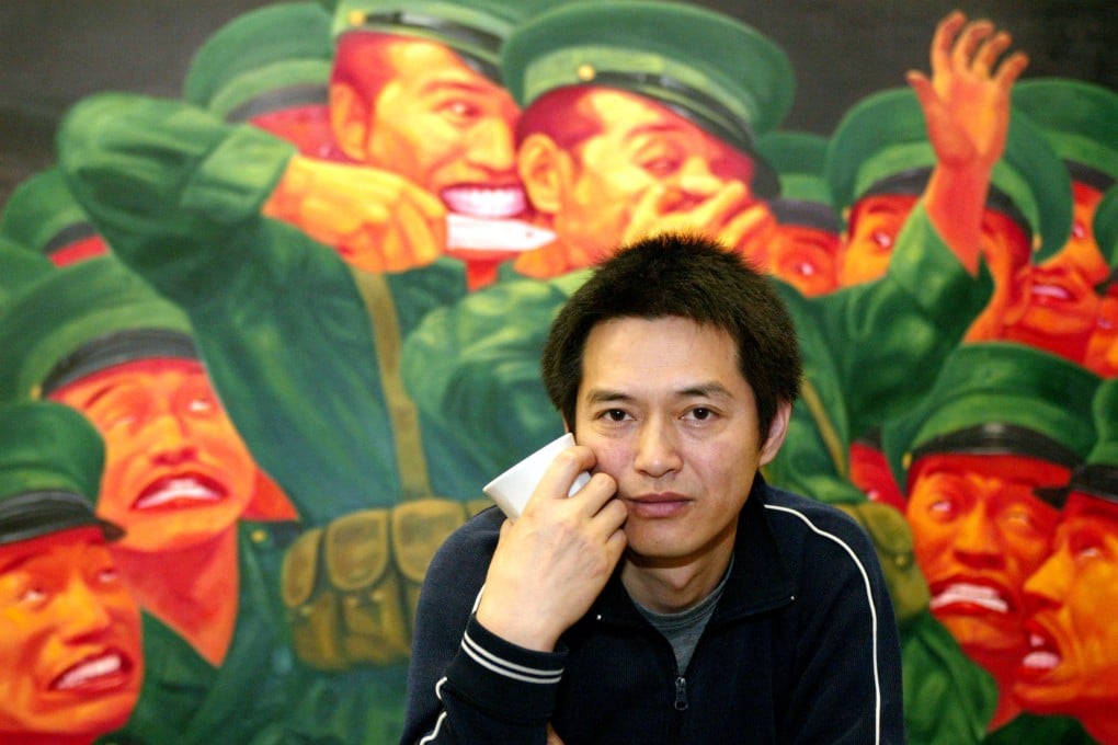 Guo Jian pictured in 2004 in front of one of his paintings on show in his Sydney studio. Photo: Reuters