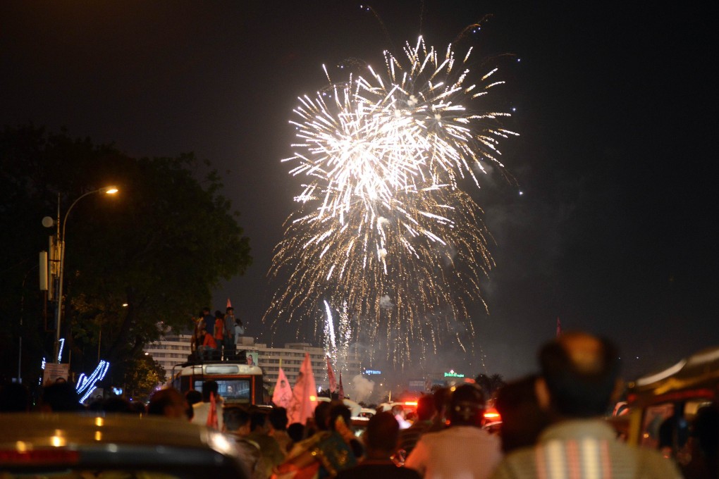 Indian supporters watch as fireworks explode to celebrate India's 29th state, Telangana, in Hyderabad. Photo: AFP