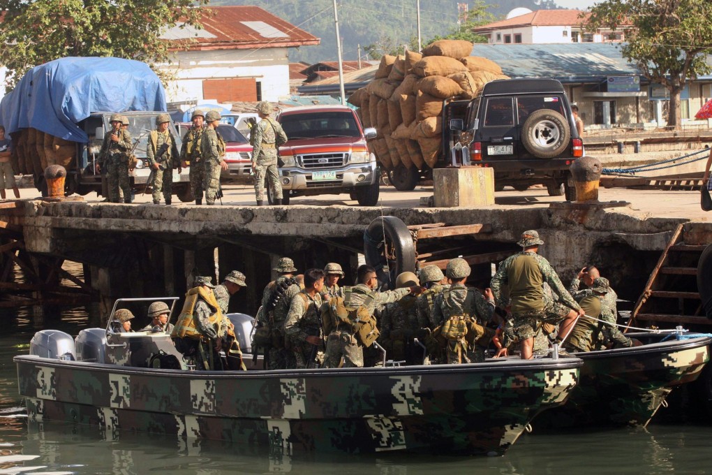 Philippine marines patrol the shore of Jolo. Philippine security forces have arrested a Muslim rebel responsible for the death of two US servicemen in a 2009 roadside bombing on the island. Photo: EPA